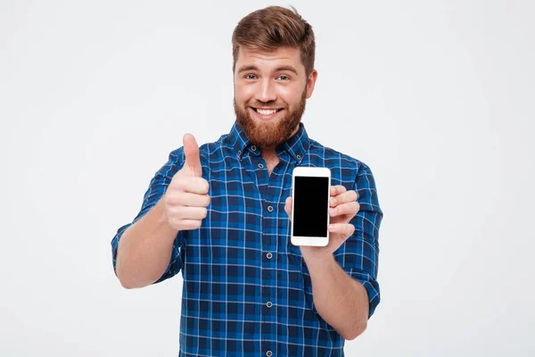 微笑显示空白智能手机屏幕有胡子的人 — 图库照片