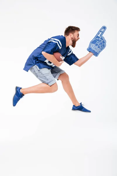 Hombre gritando ventilador en azul camiseta saltando —  Fotos de Stock