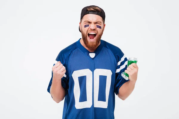 Excited man fan holding beer bottle. — Stock Photo, Image