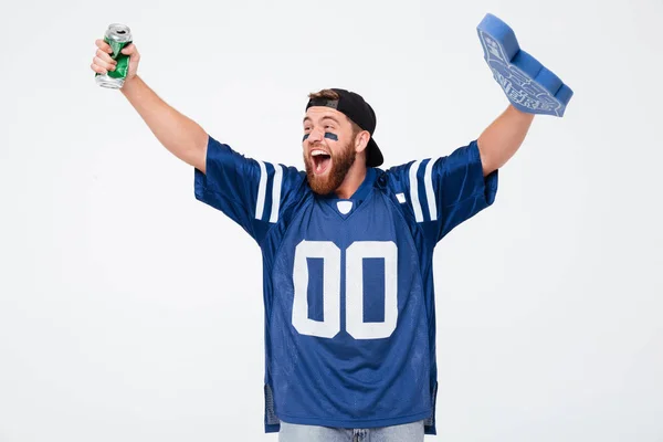 Happy man fan wearing number one fan glove drinking beer. — Stock Photo, Image