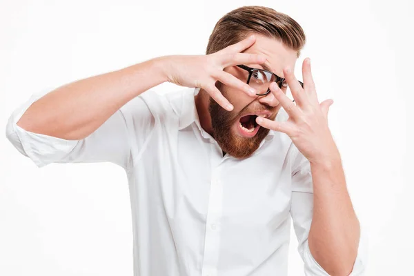 Screaming scared young bearded man — Stock Photo, Image