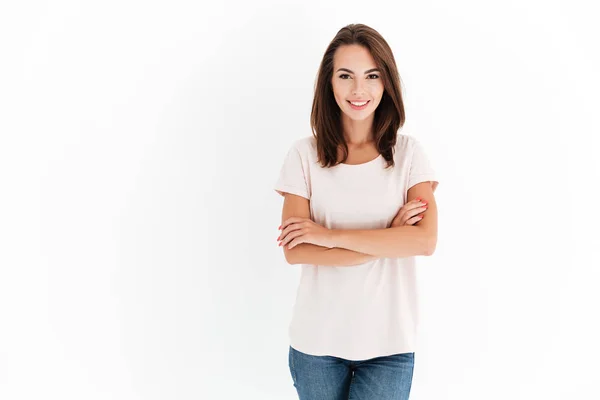 Smiling beauty woman with crossed arms looking at the camera — Stock Photo, Image