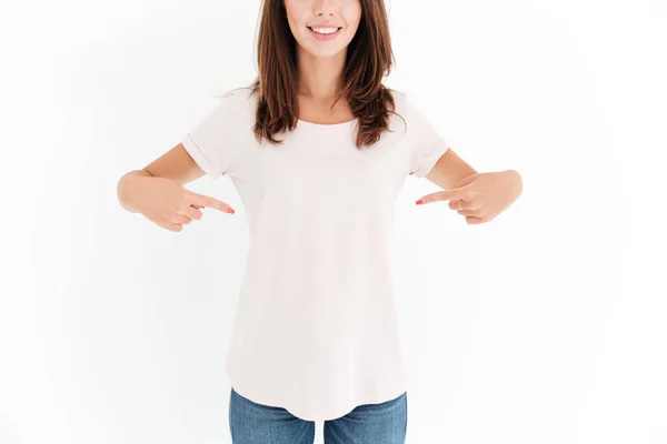 Cropped image of smiling woman pointing on her body — Stock Photo, Image