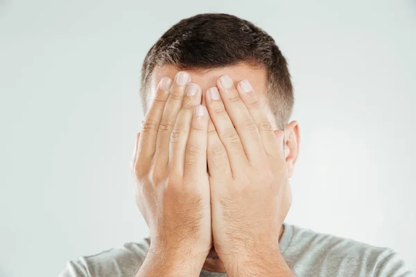 Man covering face with hands. — Stock Photo, Image