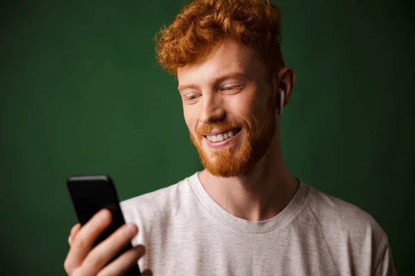 Close-up of young cheerful curly redhead bearded young man, list — Stock Photo, Image
