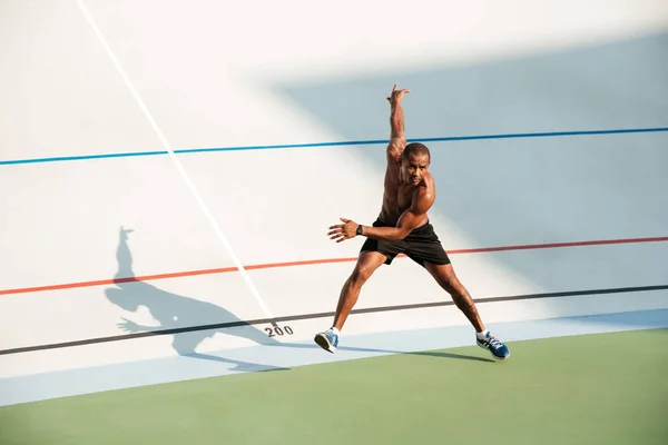 Full length portrait of a half naked muscular sportsman — Stock Photo, Image