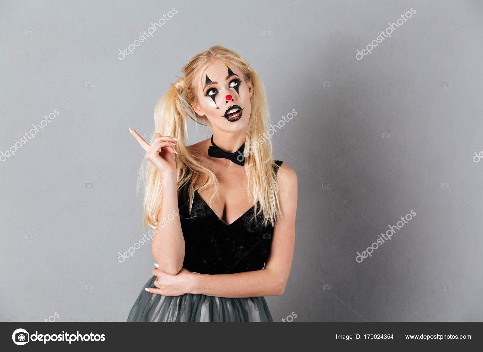 Pensive Blonde Woman In Halloween Make Up Having Idea Stock