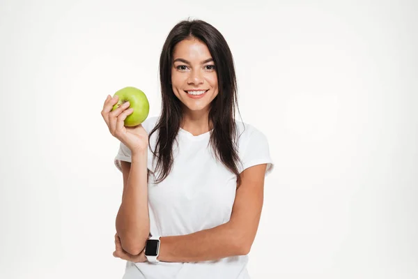 Kobieta trzyma jabłko sprawny portret szczęśliwy — Zdjęcie stockowe