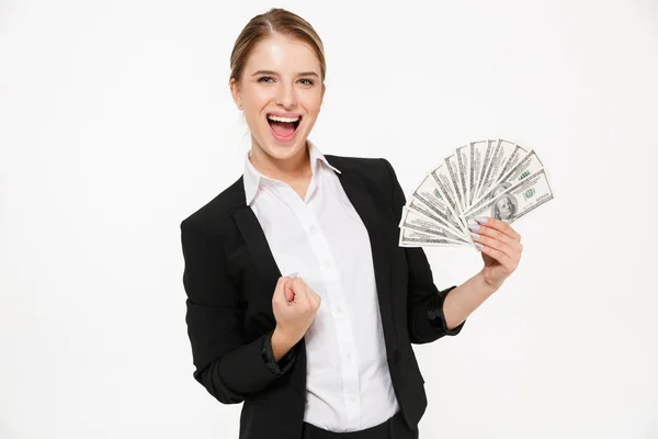 Happy screaming blonde business woman holding money — Stock Photo, Image
