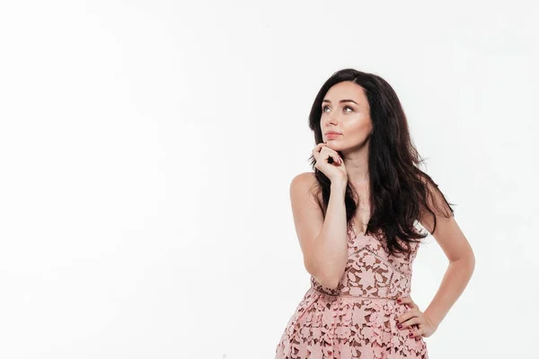 Portrait of a beautiful thoughtful brunette woman in dress — Stock Photo, Image