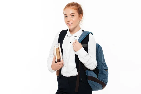 Sorrindo gigner estudante mulher posando com mochila e livros — Fotografia de Stock