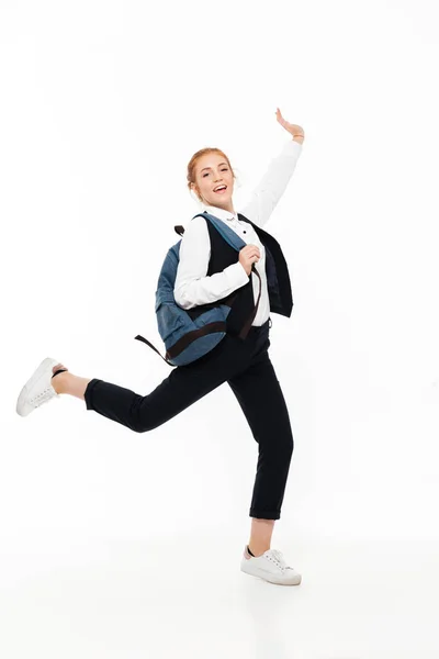 Full length image of happy gigner student woman with backpack — Stock Photo, Image