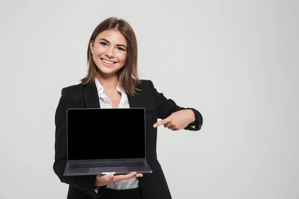 Portrait of a happy businesswoman in suit — Stock Photo, Image