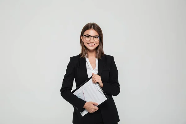 Portrait of a satisfied young businesswoman in suit — Stock Photo, Image