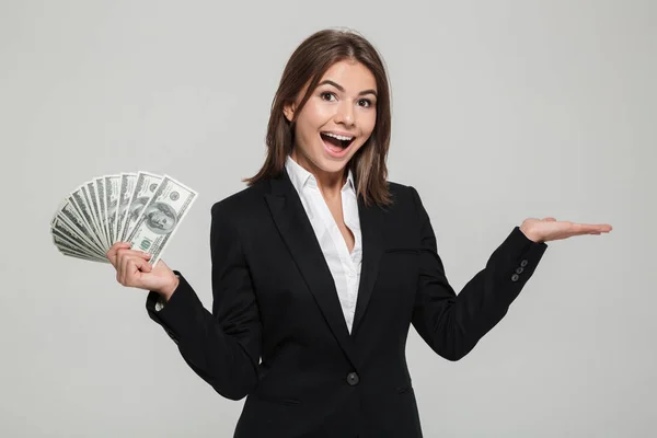 Portrait of a cheerful excited businesswoman in suit — Stock Photo, Image
