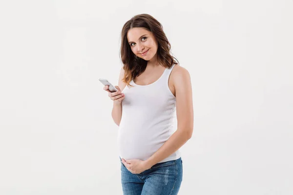 Gravid kvinna isolerade med mobiltelefon — Stockfoto