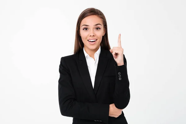 Glada affärskvinna som pekar till copyspace. — Stockfoto