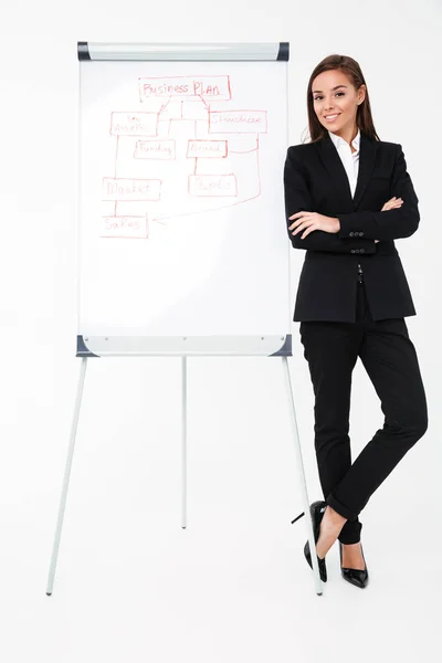 Happy pretty businesswoman near business plan — Stock Photo, Image