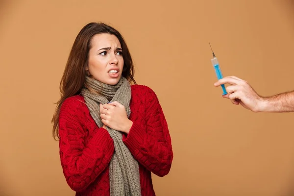 Young pretty woman afraid of injection — Stock Photo, Image
