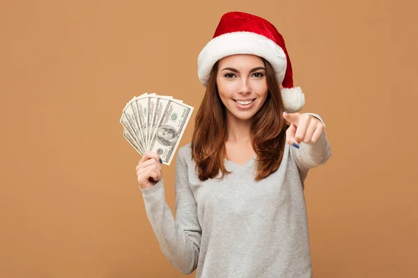 Caucasian cheerful lady wearing christmas hat pointing to you. — Stock Photo, Image