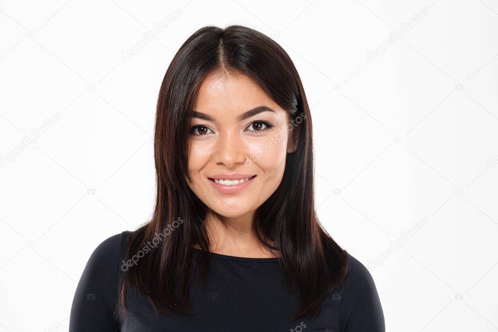 Beautiful young asian lady standing isolated over white background.