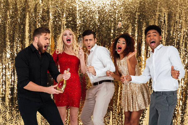 Group of excited friends celebrating