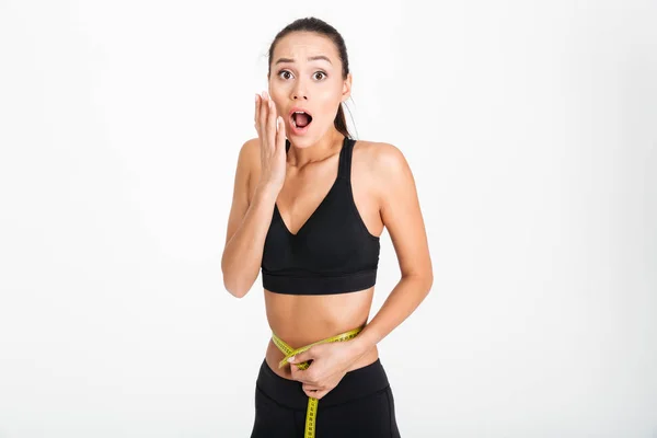 Portrait of a shocked asian fitness woman — Stock Photo, Image