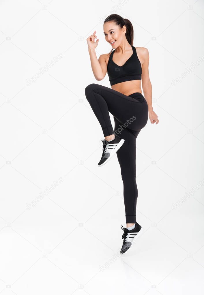Gorgeous young sports woman make exercises.