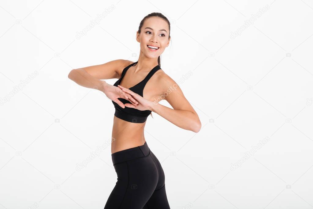 Gorgeous young sports woman make exercises.