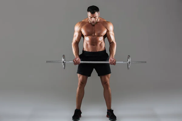 Full length portrait of a confident strong shirtless male bodybuilder — Stock Photo, Image