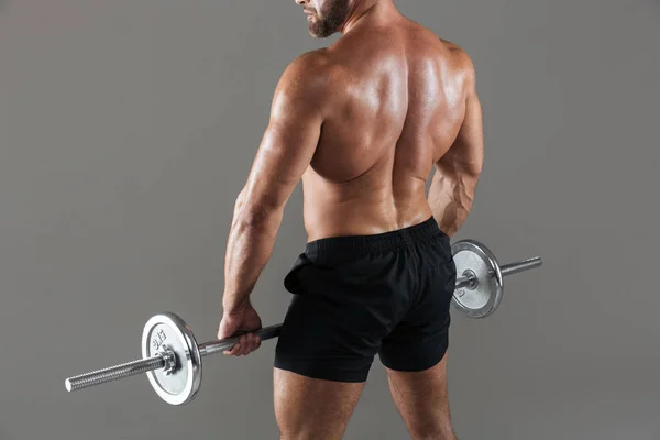 Ritratto posteriore di un bodybuilder maschio muscoloso senza maglietta — Foto Stock