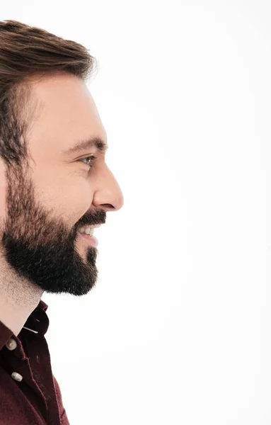 Side view half face portrait of a smiling bearded man — Stock Photo, Image