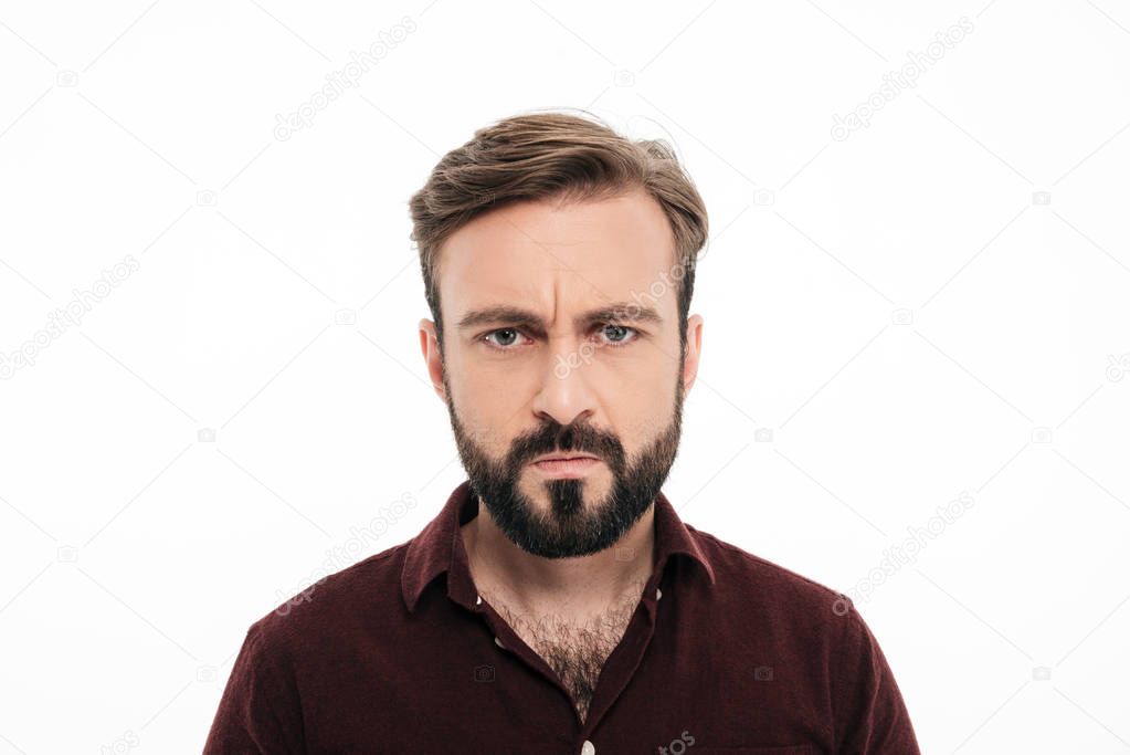 Close up portrait of frowning angry bearded man