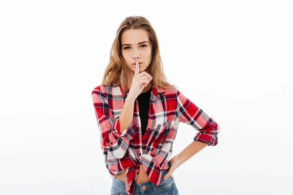 Portrait of a serious pretty girl in plaid shirt — Stock Photo, Image