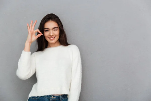 Close- up photo of funny attractive woman in white sweater showi — Stock Image Close- up photo of funny attractive woman in white sweater showi Stock Image