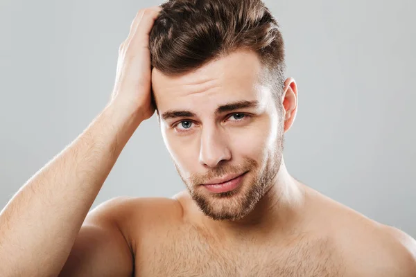 Close up portrait of a handsome man combing — Stock Photo, Image