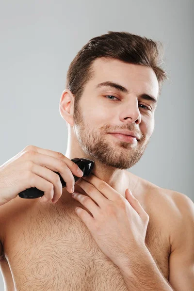 Picture of good-looking adult guy doing hygiene and health proce — Stock Photo, Image