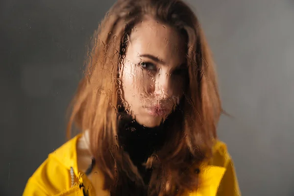 Close up of a sad girl dressed in raincoat — Stock Photo, Image