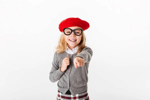 Portrait of a happy little schoolgirl dressed in uniform — Stock Photo, Image