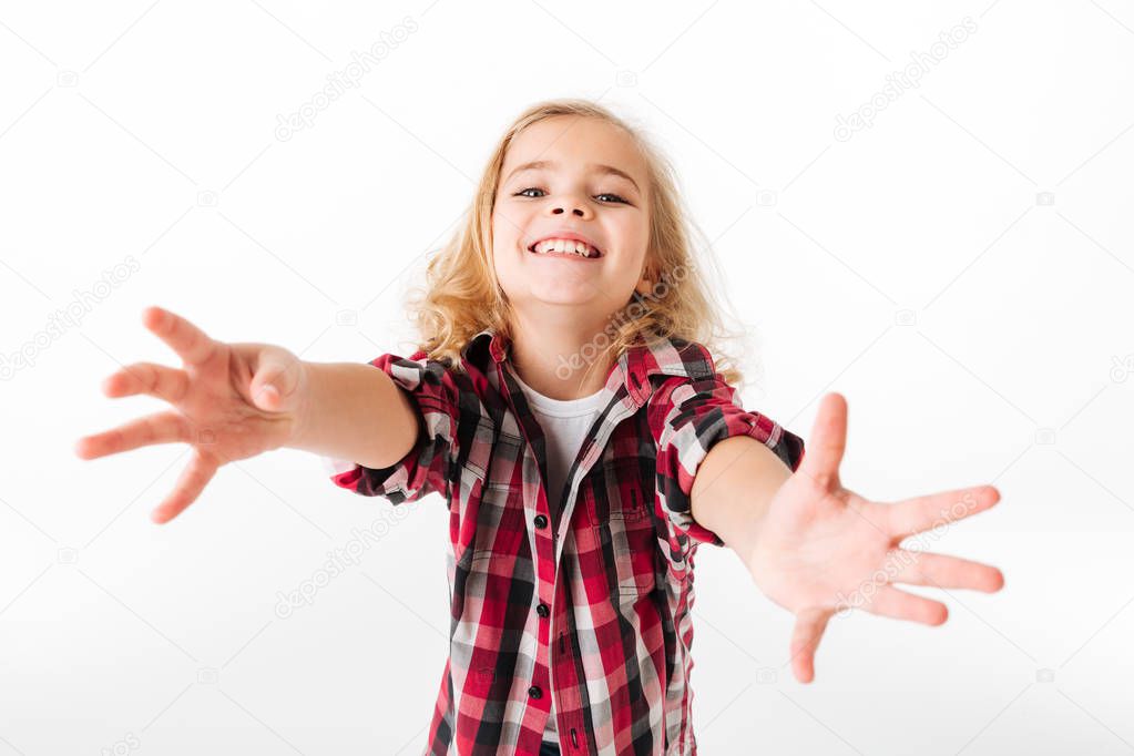 Portrait of a friendly little girl with outstretched hands