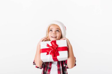 Portrait of a smiling little girl holding gift box clipart