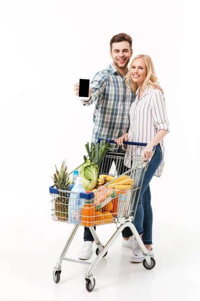 Full length portrait of a cheery couple — Stock Photo, Image