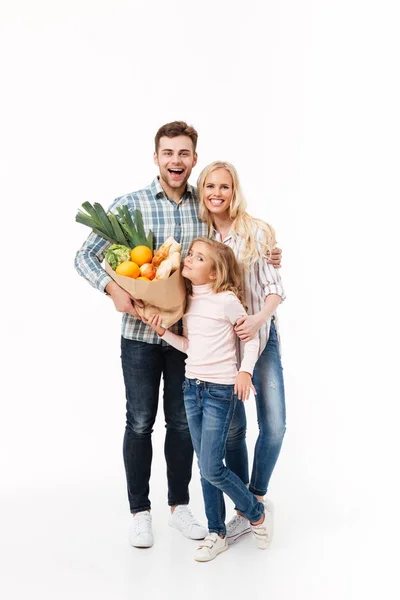 Full length portrait of a cheerful family — Stock Photo, Image