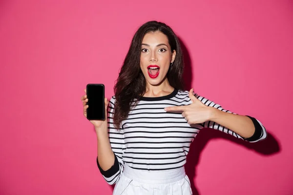 Portrait of an excited girl pointing finger — Stock Photo, Image