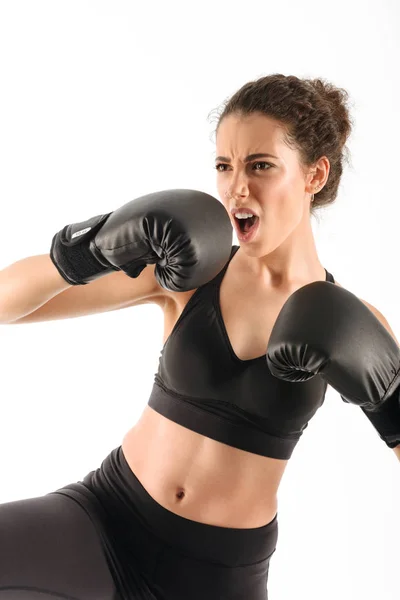 Vertical image of cool screaming curly brunette fitness woman — Stock Photo, Image