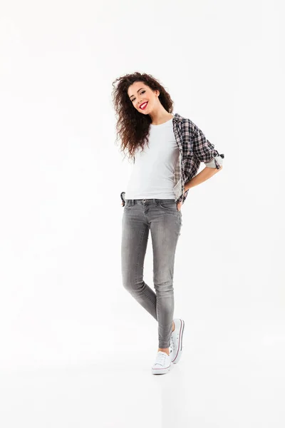 Full length image of Happy curly woman posing in studio — Stock Photo, Image