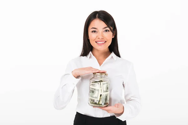 Portrait of a confident asian businesswoman holding jar — Stock Photo, Image