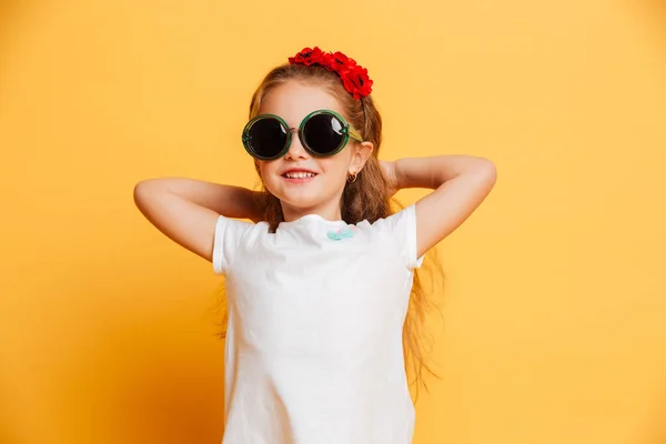 Little cute smiling girl wearing sunglasses looking camera. — Stock Photo, Image