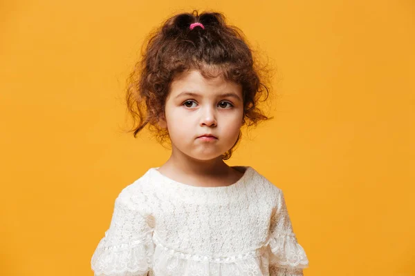 Serious little girl child standing isolated — Stock Photo, Image