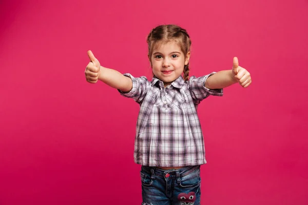 Happy cute little girl child showing thumbs up. — Stock Photo, Image